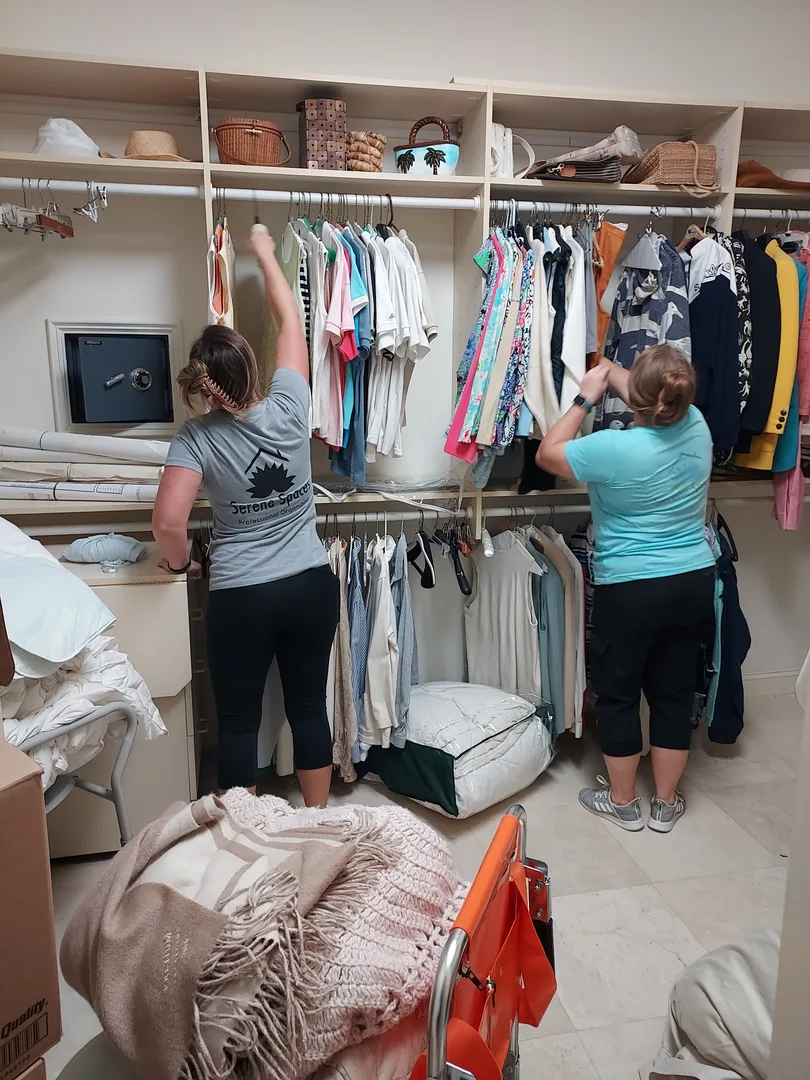 Serene Spaces Team going through clothes in a closet