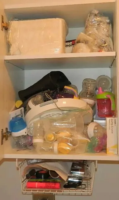 laundry room cabinet before organzing