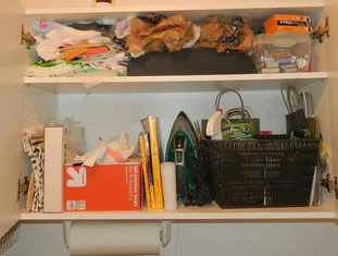 laundry room cabinet before organzing